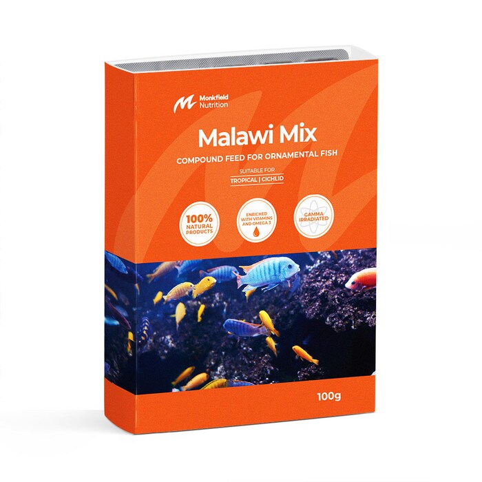 Packaging of Monkfield Nutrition Malawi Mix compound feed for ornamental fish, featuring an orange box with an image of colorful tropical fish swimming among rocks, suitable for tropical cichlid fish, enriched with vitamins and omega-3, and gamma irradiated for safety.