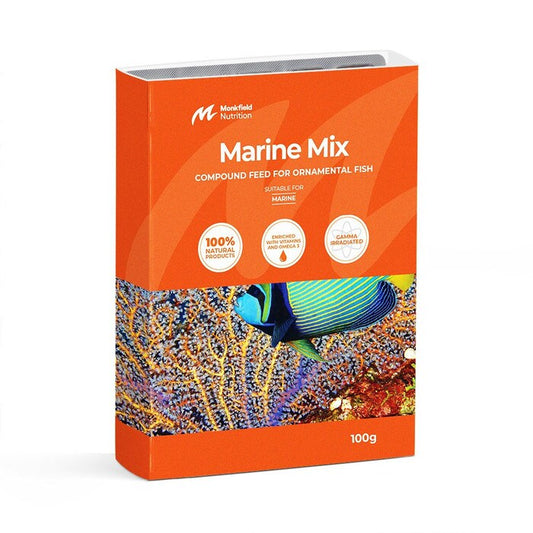 Packaging of Monkfield Nutrition Marine Mix compound feed for ornamental fish, featuring an orange box with an image of a colorful marine fish swimming near coral, suitable for marine fish, enriched with vitamins and omega-3, and gamma irradiated for safety.